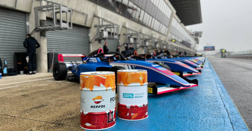 Repsol biofuel drums next to F4 cars