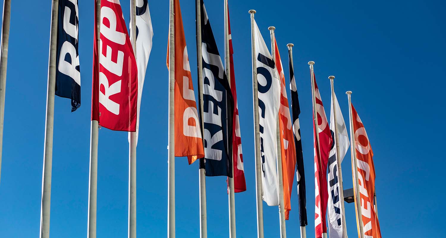 Image of several flags with the Repsol logo