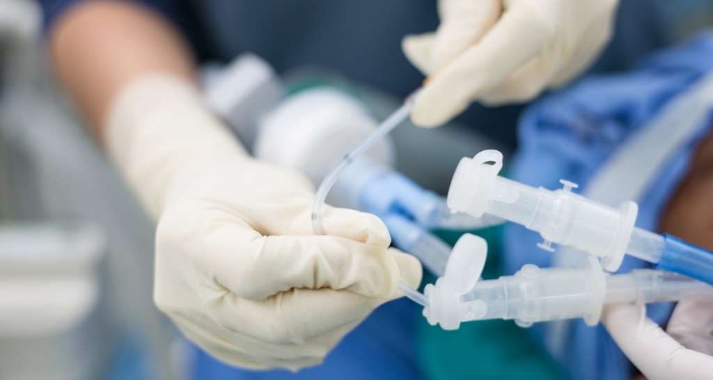 Close-up of hands handling medical equipment