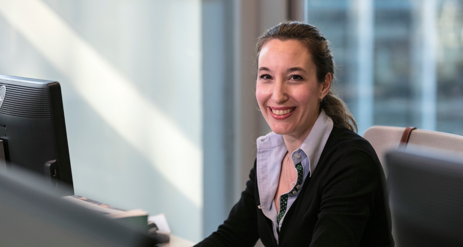 A Repsol employee smiling at work