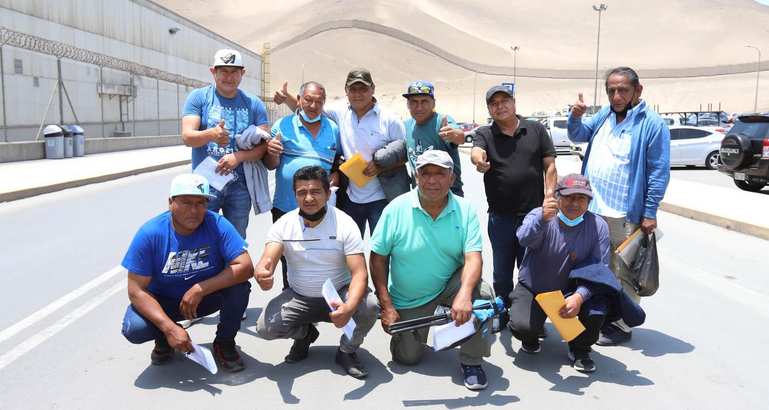 People who signed a compensation agreement posing together