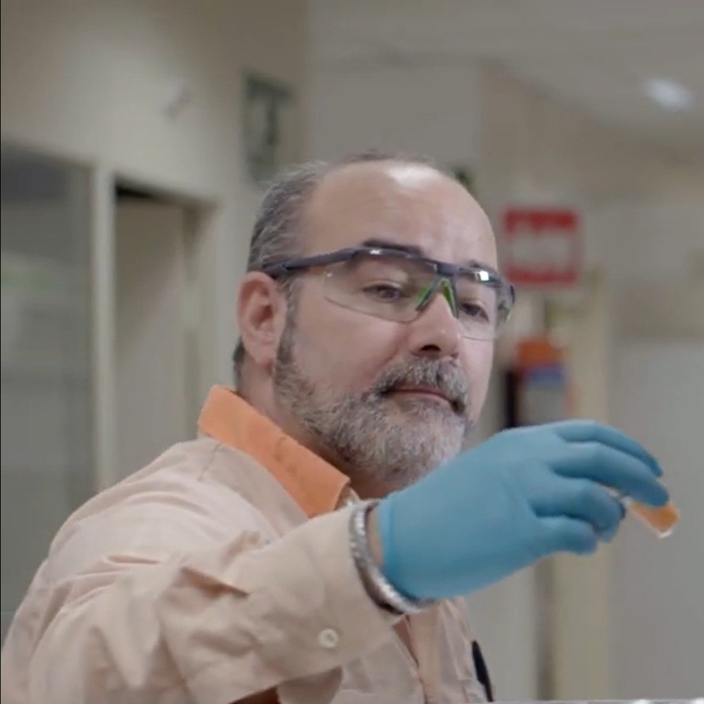 Scientist looking at a jar
