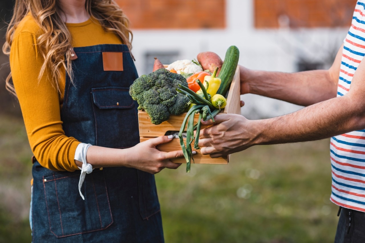 two people sharing local or zero-mile produce