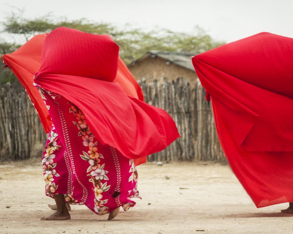 A woman from La Guajira covers herself with a scarf