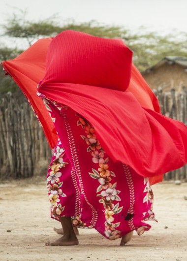 A woman from La Guajira covers herself with a scarf