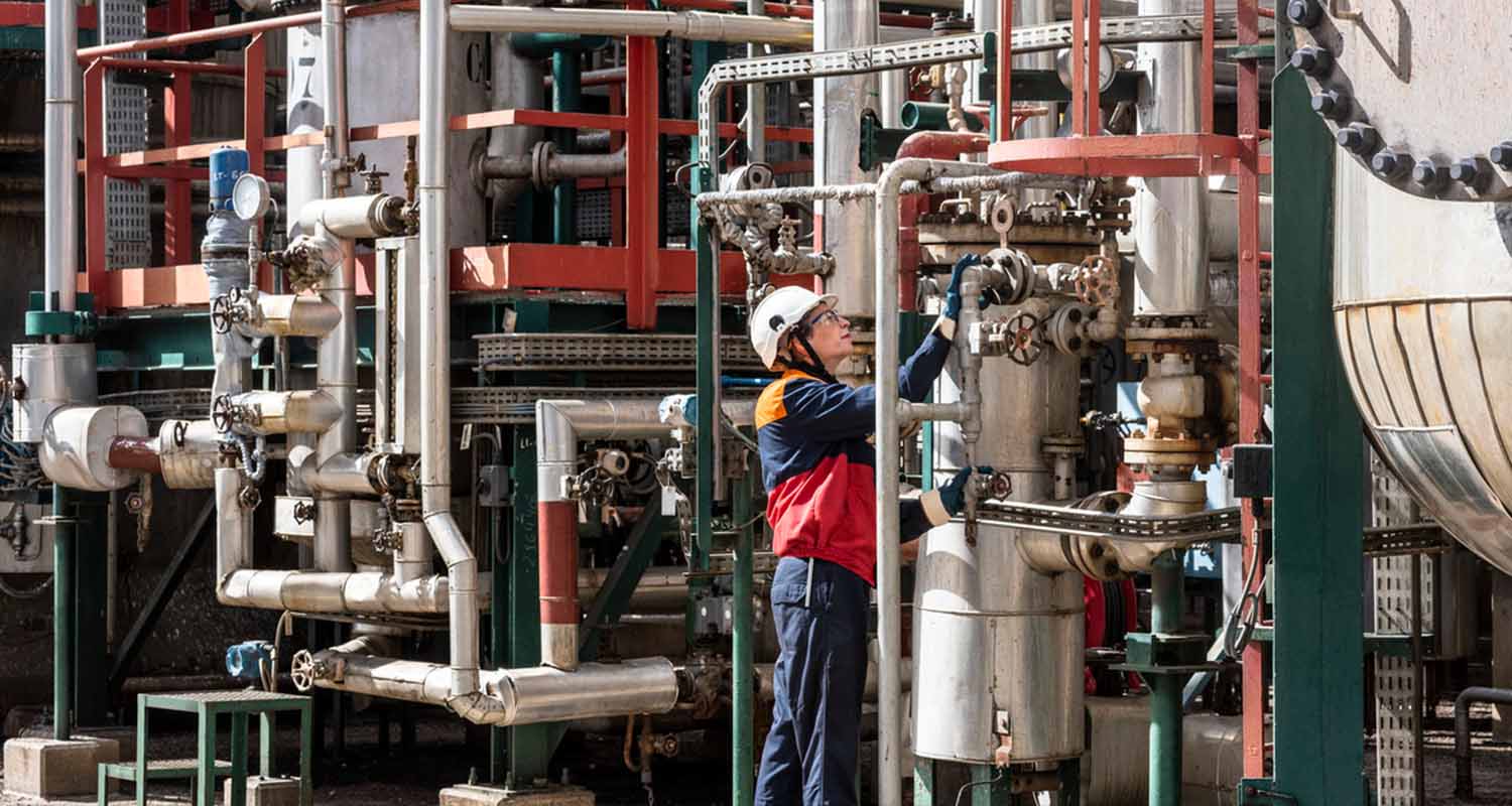 A woman working in a refinery