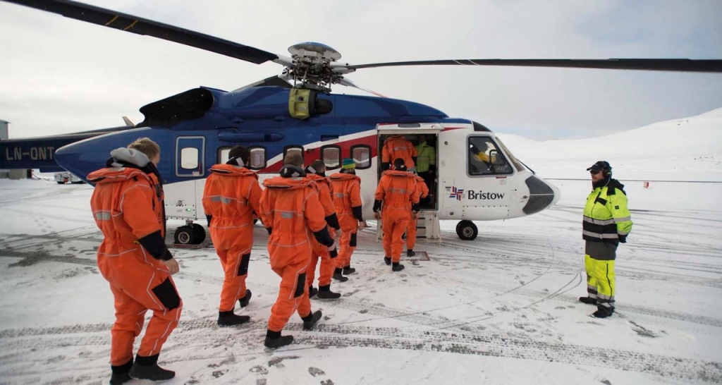 Operators getting on a helicopter