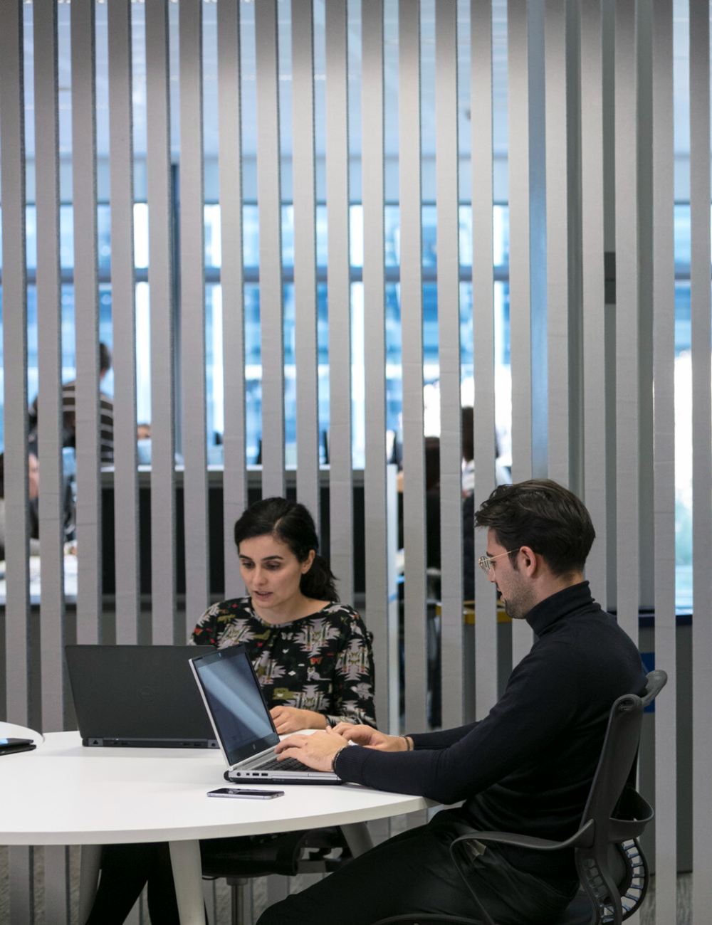 Repsol employees working together at the office.