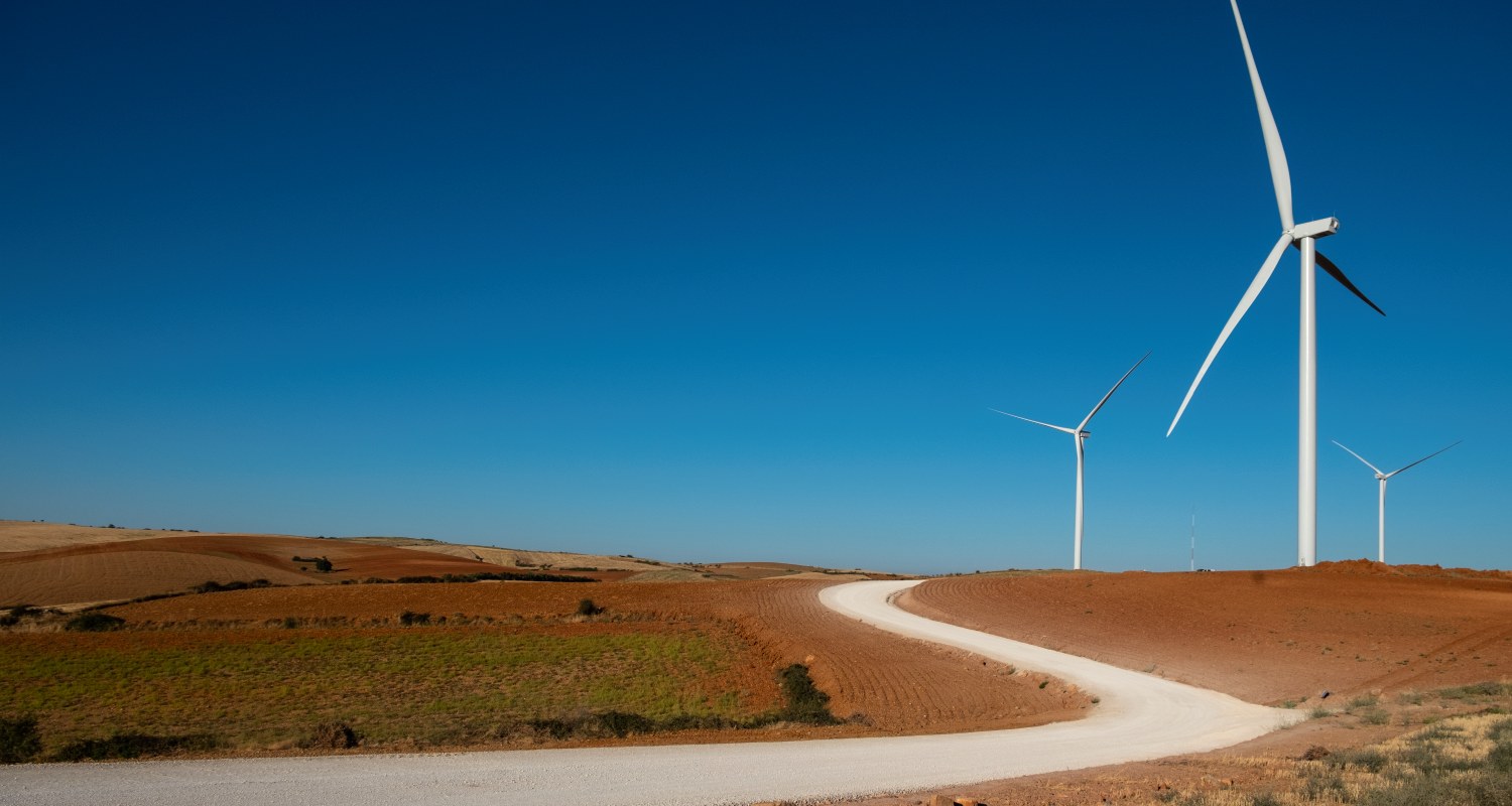 Several windmills on a field