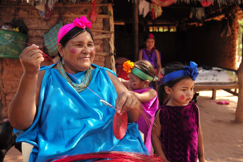 Smiling indigenous woman and young girl together
